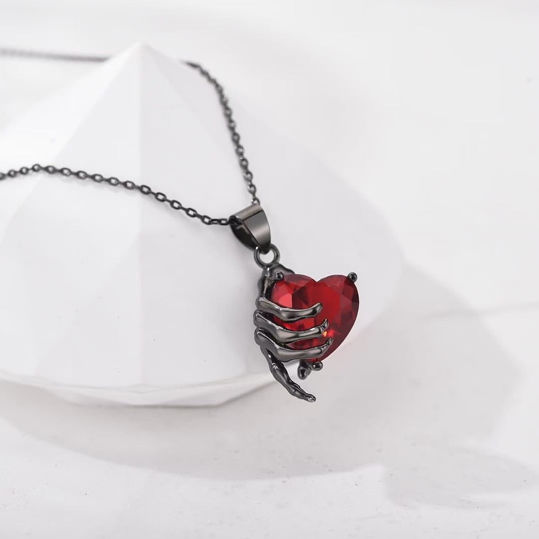 Gothic Hand Holding Red Heart Gemstone Necklace