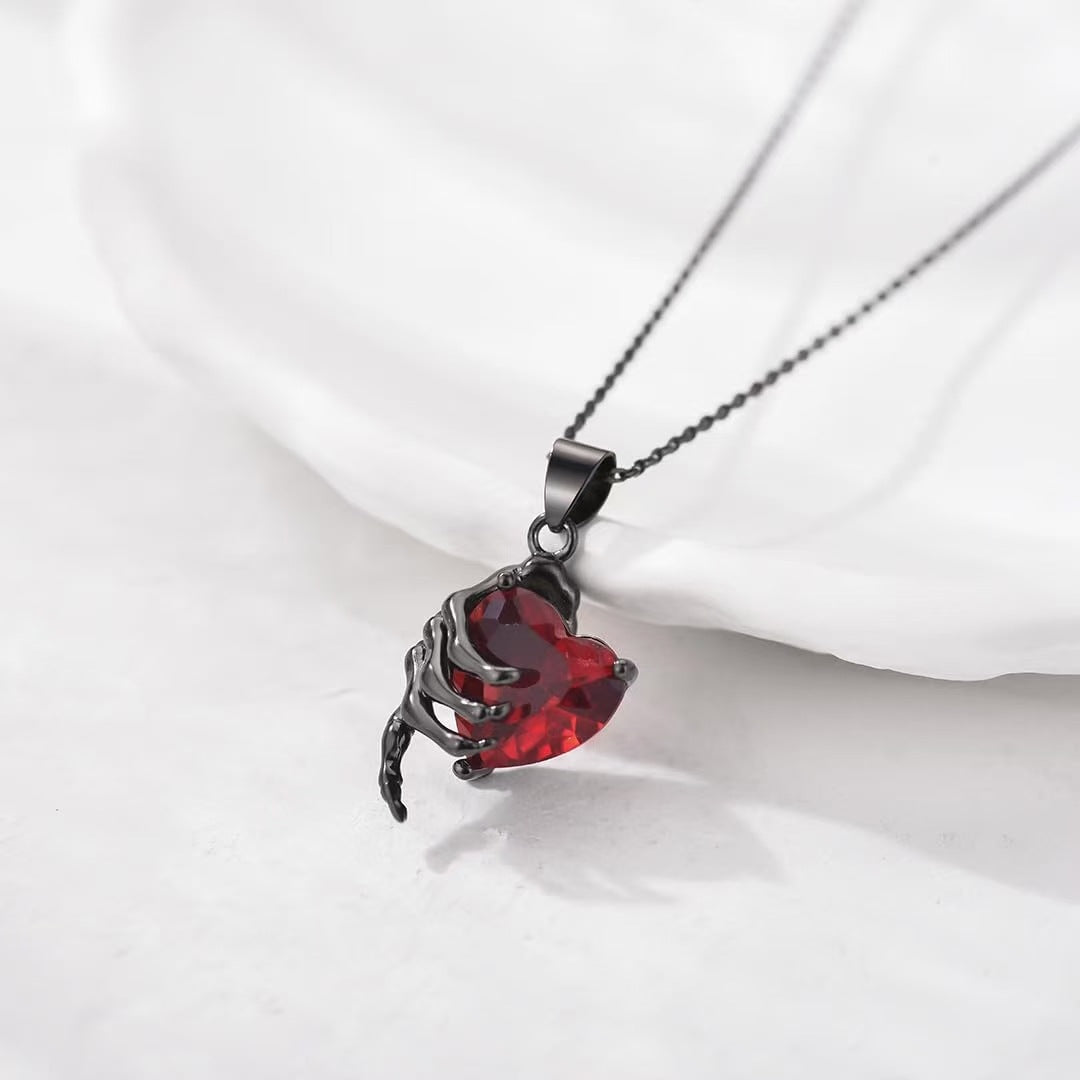 Gothic Hand Holding Red Heart Gemstone Necklace