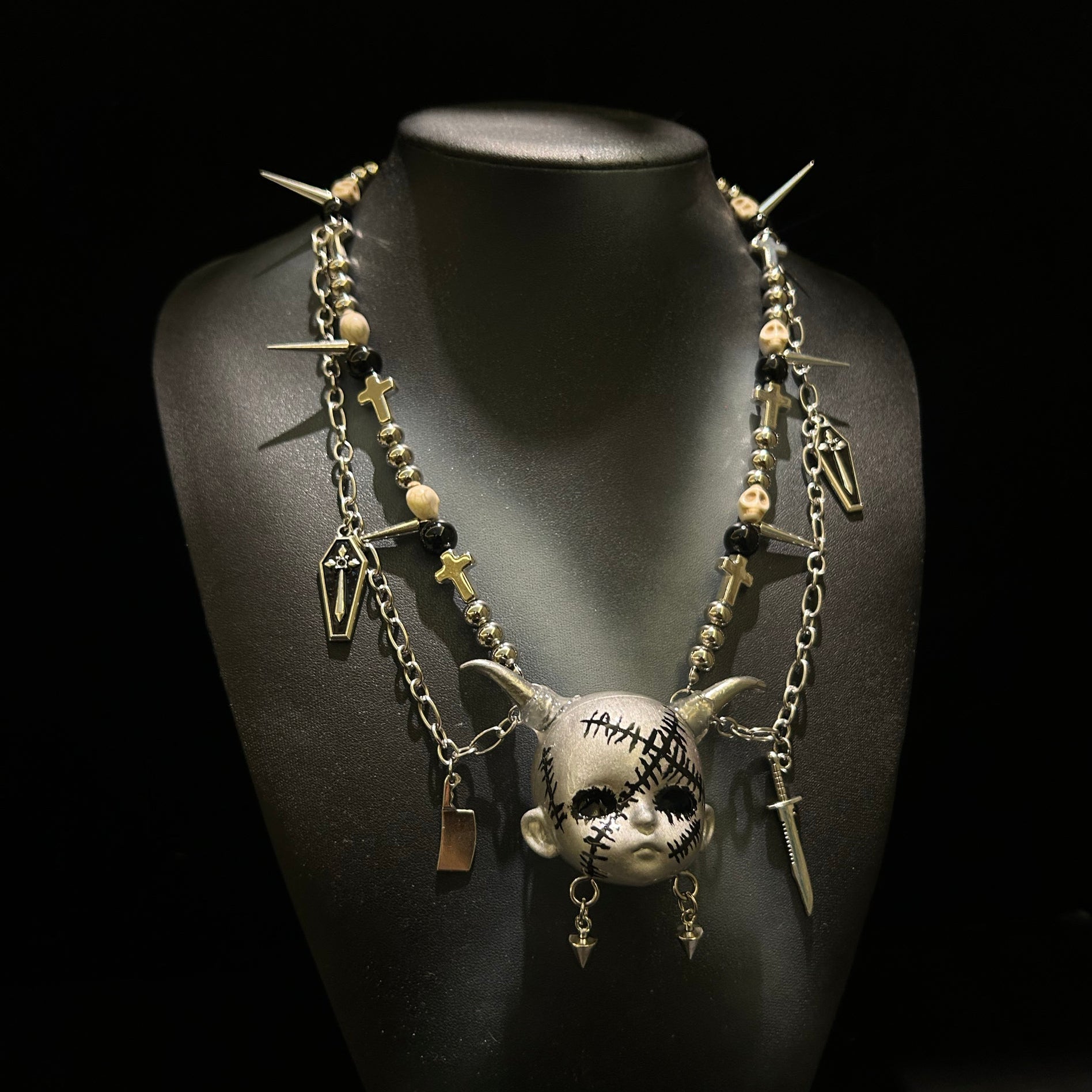 Silver scar baby head necklace