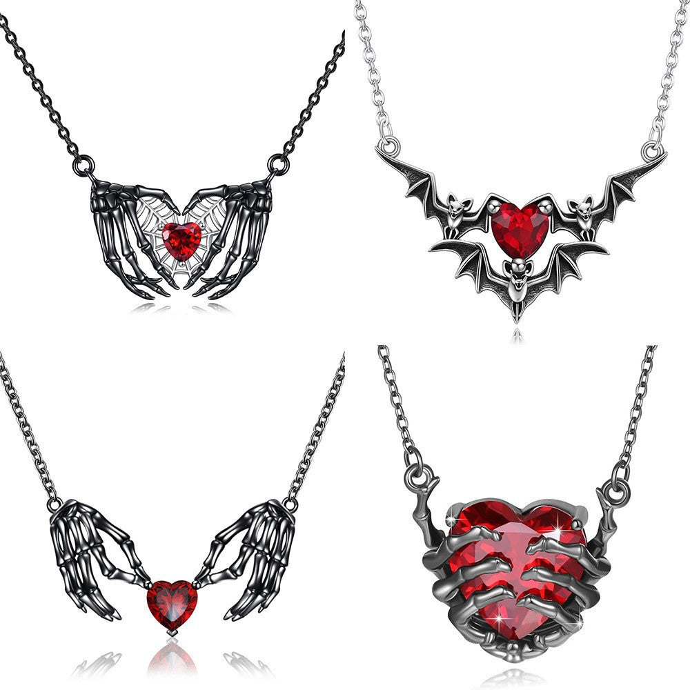 Dark Red Heart Gemstone Skull Claw Pendant