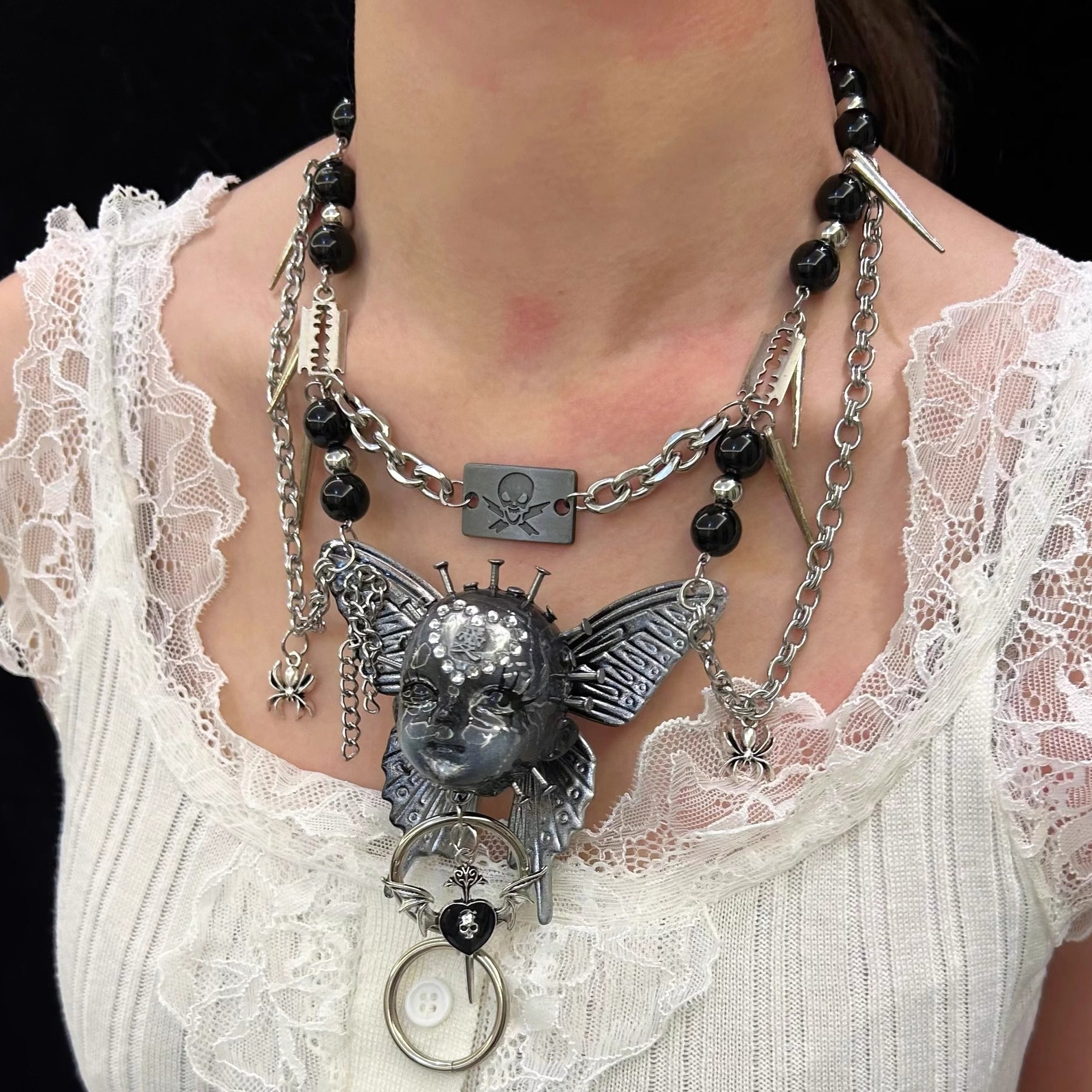 Gothic metal doll head necklace