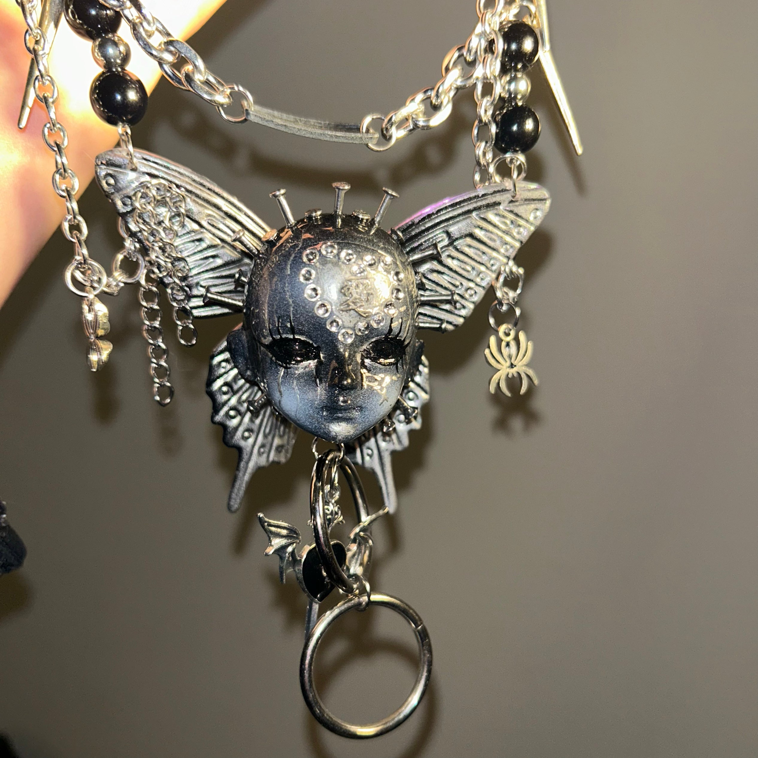 Gothic metal doll head necklace