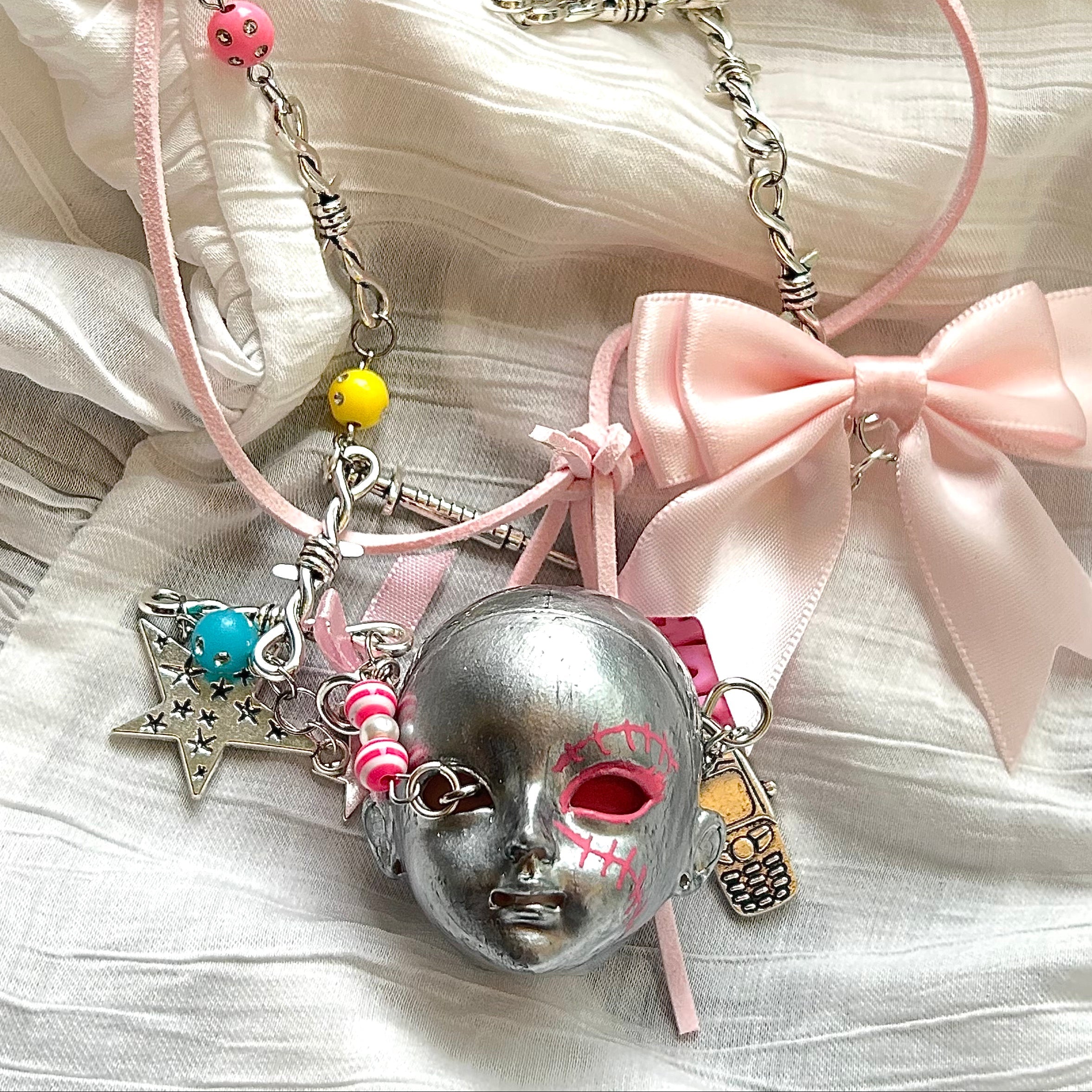 Bow doll head choker