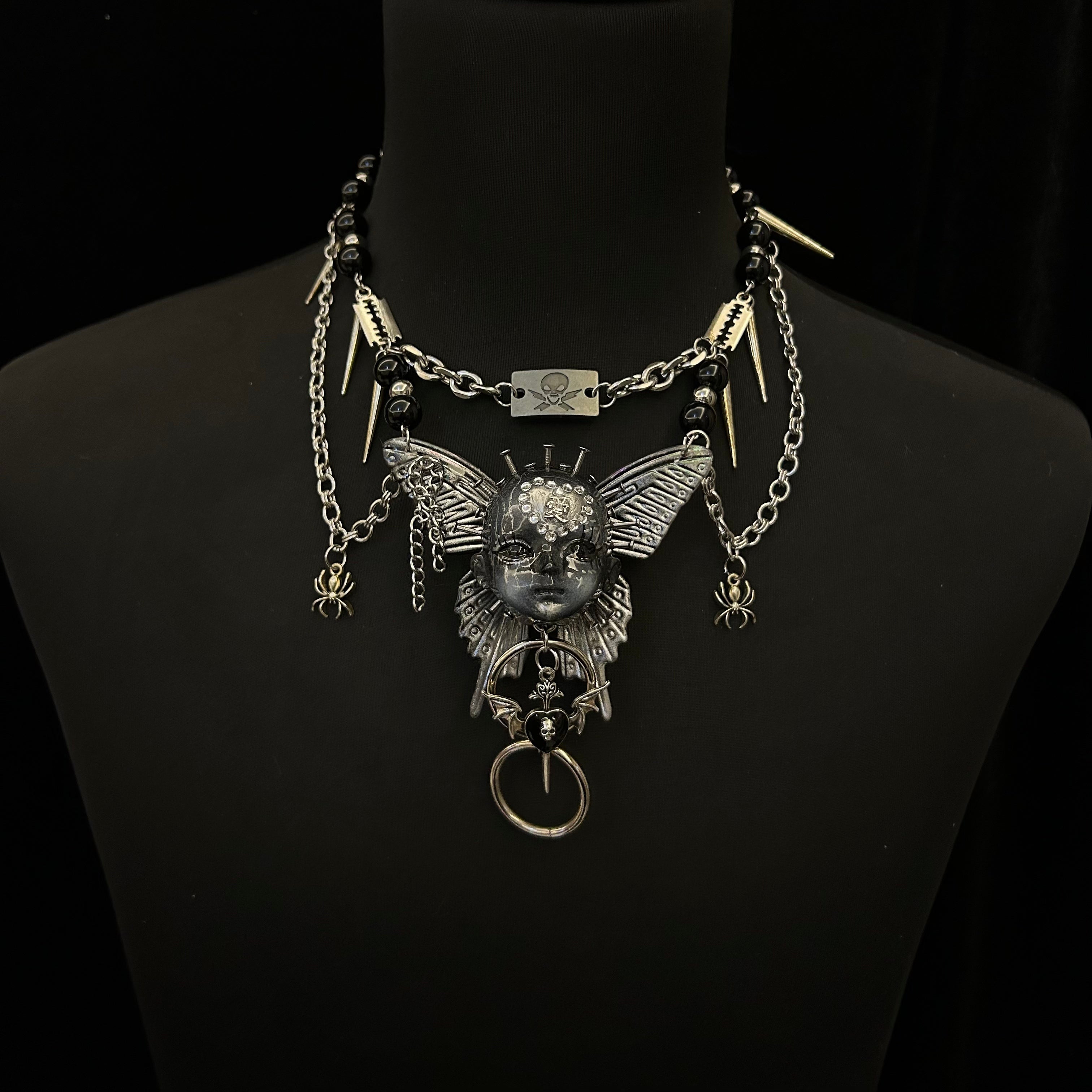 Gothic metal doll head necklace